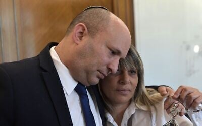 Prime Minister Naftali Bennett, left, hugs Nitza Shmueli, whose border guard son Barel was shot dead by a Palestinian gunman on the Gaza border in August, at the Prime Minister's Office in Jerusalem on October 27, 2021. (Kobi Gideon/PMO) Prime Minister Naftali Bennett, left, hugs Nitza Shmueli, whose border guard son Barel was shot dead by a Palestinian gunman on the Gaza border in August, at the Prime Minister's Office in Jerusalem on October 27, 2021. (Kobi Gideon/PMO)
