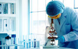 An illustrative photo of a scientist in working in a lab. (Rapeepat Pornsipak via iStock by Getty Images)