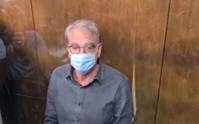 Prof. Arie Levine appears at Tel Aviv Magistrate's Court on October 4, 2021 (Screen grab/Channel 12 news)