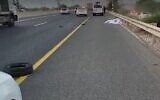 The scene where a 42-year-old man was killed when he was hit by a truck while changing a tire on his car near Hadera, October 25, 2021 (Screen grab/Magen David Adom)