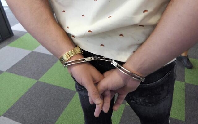 Illustrative: An employee of the Bulgarian call center Dortome BG is handcuffed on October 6, 2021, during a Europol-coordinated raid (Source: Bulgarian Interior Ministry) Illustrative: An employee of the Bulgarian call center Dortome BG is handcuffed on October 6, 2021, during a Europol-coordinated raid (Source: Bulgarian Interior Ministry)