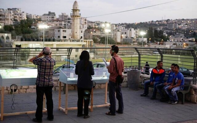 Gazing at exhibits that are part of Manofim, the Jerusalem art event opening October 27, 2021 (Courtesy Snir Katzir) Gazing at exhibits that are part of Manofim, the Jerusalem art event opening October 27, 2021 (Courtesy Snir Katzir)