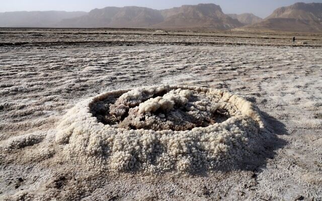 Patterns formed by crystalized minerals some 20Km south of Kibbutz Ein Gedi in the southern part of the Dead Sea, a dried-up sea stretch which exposed and created a salt plain, seen December 26, 2020. (Menahem KAHANA / AFP) Patterns formed by crystalized minerals some 20Km south of Kibbutz Ein Gedi in the southern part of the Dead Sea, a dried-up sea stretch which exposed and created a salt plain, seen December 26, 2020. (Menahem KAHANA / AFP)