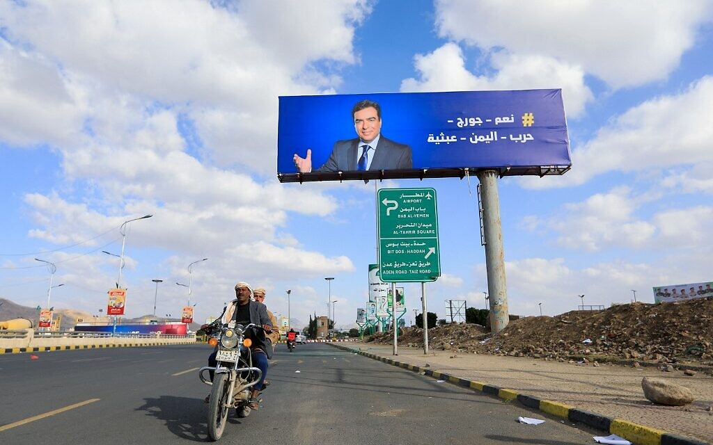 A portrait of Lebanese Information Minister George Kordahi is displayed on a billboard in the Yemeni capital Sanaa on October 31, 2021. (Mohammed HUWAIS / AFP) A portrait of Lebanese Information Minister George Kordahi is displayed on a billboard in the Yemeni capital Sanaa on October 31, 2021. (Mohammed HUWAIS / AFP)