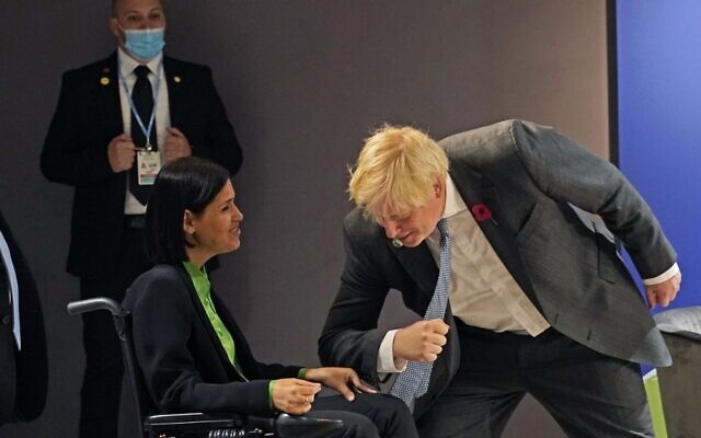 Britain's Prime Minister Boris Johnson (R) greets Israel's Energy Minister Karine Elharrar prior to a meeting with Israel's Prime Minister Naftali Bennett on the sidelines of the COP26 Climate Conference at the Scottish Event Campus in Glasgow, Scotland on November 2, 2021.(Alberto Pezzali / POOL / AFP) Britain's Prime Minister Boris Johnson (R) greets Israel's Energy Minister Karine Elharrar prior to a meeting with Israel's Prime Minister Naftali Bennett on the sidelines of the COP26 Climate Conference at the Scottish Event Campus in Glasgow, Scotland on November 2, 2021.(Alberto Pezzali / POOL / AFP)