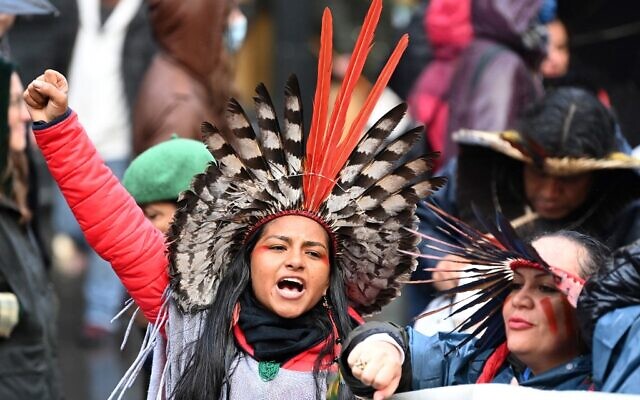 Members of an Indigenous community participate in a protest rally during a global day of action on climate change in Glasgow on November 6, 2021, during the COP26 UN Climate Change Conference.(DANIEL LEAL-OLIVAS / AFP)