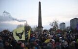 People participate in a protest rally during a global day of action on climate change in Glasgow, on November 6, 2021, during the COP26 UN Climate Change Conference. (Daniel Leal-Olivas/AFP)