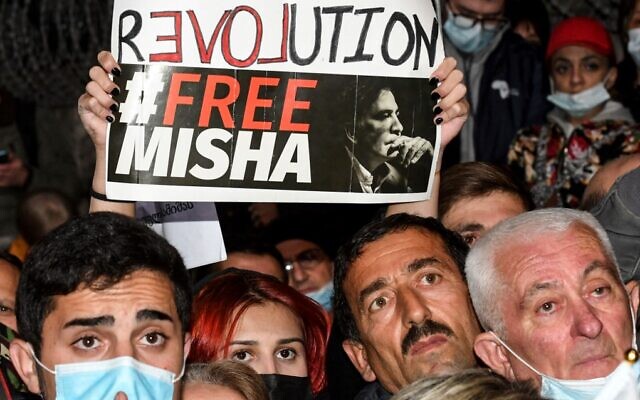 Protesters hold a placard reading "Revolution Free Misha" during a rally in front of the prison of Rustavi, to demand the release of ex-president and opposition leader Mikheil Saakashvili, outside Tbilisi, on November 6, 2021. - (Vano Shlamov/AFP) Protesters hold a placard reading "Revolution Free Misha" during a rally in front of the prison of Rustavi, to demand the release of ex-president and opposition leader Mikheil Saakashvili, outside Tbilisi, on November 6, 2021. - (Vano Shlamov/AFP)