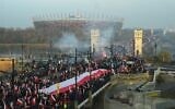 People wave national flags of Poland during a march to mark Poland's National Independence Day on November 11, 2021 in Warsaw. (Adam Chelstowski / AFP)