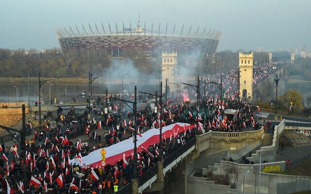 People wave national flags of Poland during a march to mark Poland's National Independence Day on November 11, 2021 in Warsaw. (Adam Chelstowski / AFP) People wave national flags of Poland during a march to mark Poland's National Independence Day on November 11, 2021 in Warsaw. (Adam Chelstowski / AFP)