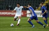 Scotland's striker Che Adams shoots the ball during the FIFA World Cup Qatar 2022 qualification football match between Moldova and Scotland at Chisinau's Zimbru Stadium on November 12, 2021. (Bogdan TUDOR / AFP)