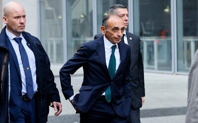 French far-right media pundit Eric Zemmour, surrounded by bodyguards, arrives to visit the "Made in France" fair at the Porte de Versailles in Paris, on November 14, 2021. (Thomas Samson/AFP)