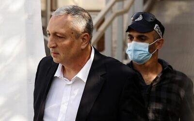 Illustrative: Nir Hefetz, former spokesman of Benjamin Netanyahu, is pictured outside a Jerusalem court house, on November 16, 2021. (JACK GUEZ / POOL / AFP)