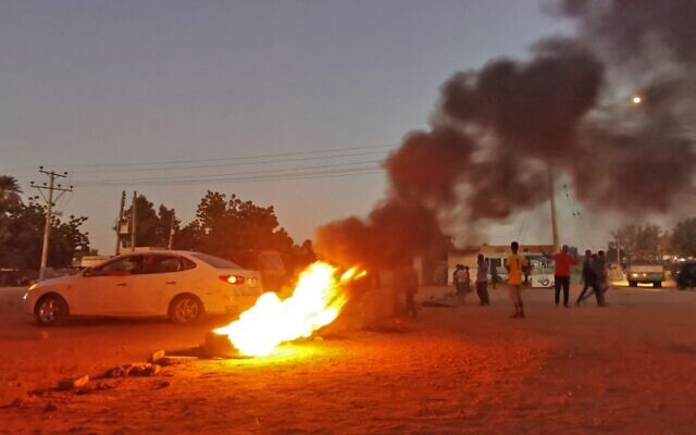 Sudanese anti-coup protesters burn tires amid ongoing protests against last month's widely condemned military takeover, in the capital Khartoum on November 17, 2021. (AFP)