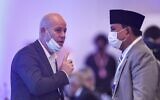 Itay Tagner, Israel's chargé d'affaires to Bahrain (left), speaks with Indonesia's Defense Minister Prabowo Subianto during the 17th IISS Manama Dialogue in the Bahraini capital Manama, on November 20, 2021. (Mazen Mahdi/AFP)