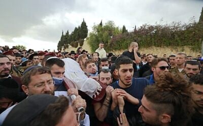 Mourners carry the body of 26-year-old Eliyahu Kay during his funeral in Jerusalem the day after he was killed by a Palestinian gunman in a terror attack, on November 22, 2021. (Menahem KAHANA / AFP) Mourners carry the body of 26-year-old Eliyahu Kay during his funeral in Jerusalem the day after he was killed by a Palestinian gunman in a terror attack, on November 22, 2021. (Menahem KAHANA / AFP)