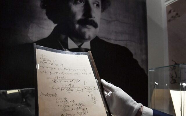 A picture taken on November 22, 2021, shows pages of one of the preparatory manuscript to the theory of general relativity of Albert Einstein, during their presentation a day before being auctioned at Christie's auction house in Paris. (Alain JOCARD / AFP) A picture taken on November 22, 2021, shows pages of one of the preparatory manuscript to the theory of general relativity of Albert Einstein, during their presentation a day before being auctioned at Christie's auction house in Paris. (Alain JOCARD / AFP)