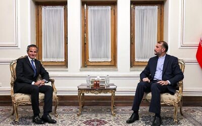 Director-General of the International Atomic Energy Agency (IAEA) Rafael Grossi, left, meets with Iran's Foreign Minister Hossein Amir-Abdollahian at the foreign ministry headquarters in the capital Tehran on November 23, 2021. (ATTA KENARE / AFP)