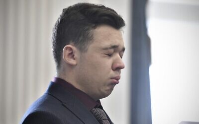 Kyle Rittenhouse closes his eyes and cries as he is found not guilty on all counts at the Kenosha County Courthouse on November 19, 2021, in Kenosha, Wisconsin. (Sean Krajacic/Pool/Getty Images/AFP)