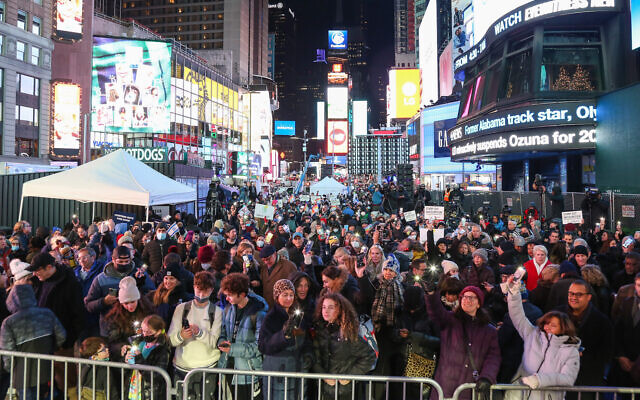 Hundreds gather in Times Square for the Shine a Light on Antisemitism event marking the second night of Hanukkah, Nov. 29, 2021. (Michael Priest Photography via JTA) Hundreds gather in Times Square for the Shine a Light on Antisemitism event marking the second night of Hanukkah, Nov. 29, 2021. (Michael Priest Photography via JTA)