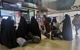 Members of the Lev Tahor sect prepare to depart from La Aurora International Airport in Guatemala City on a journey to Iraqi Kurdistan in October 2021. (Courtesy)