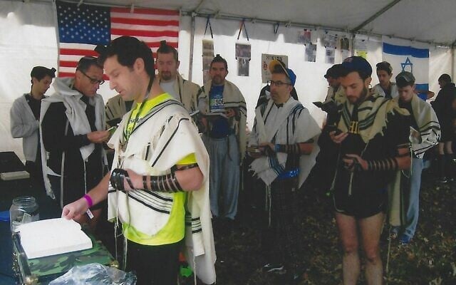 The NYC Marathon minyan, run by a group of 10 volunteer staff, attracted hundreds of participants in 2019. (Peter Berkowsky)