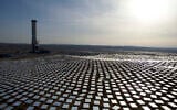 In this Dec. 22, 2016 photo, 50,000 mirrors, known as heliostats,encircle the solar tower in the Negev desert, near in Ashelim, southern Israel.  (AP Photo/Oded Balilty)