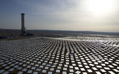 In this Dec. 22, 2016 photo, 50,000 mirrors, known as heliostats,encircle the solar tower in the Negev desert, near in Ashelim, southern Israel.  (AP Photo/Oded Balilty)