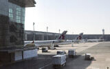 In this Friday, June 16, 2017 photo, Qatar Airways planes are seen parked at the Hamad International Airport in Doha, Qatar. (AP Photo/Malak Harb)