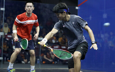 Illustrative: Malaysia's Ng Ean Yow, right, and Hong Kong's Au Chun Ming during the men's team squash final match at the 18th Asian Games in Jakarta, Indonesia, September 1, 2018. (AP Photo/Firdia Lisnawati)
