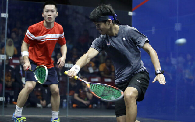 Illustrative: Malaysia's Ng Ean Yow, right, and Hong Kong's Au Chun Ming during the men's team squash final match at the 18th Asian Games in Jakarta, Indonesia, September 1, 2018. (AP Photo/Firdia Lisnawati) Illustrative: Malaysia's Ng Ean Yow, right, and Hong Kong's Au Chun Ming during the men's team squash final match at the 18th Asian Games in Jakarta, Indonesia, September 1, 2018. (AP Photo/Firdia Lisnawati)