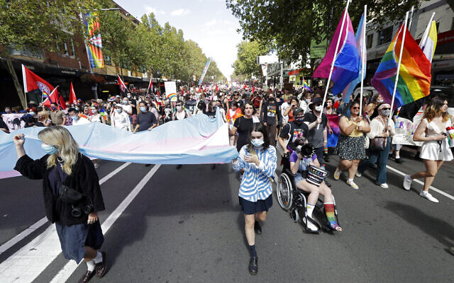Illustrative -- Hundreds of protesters march in Sydney, March 6, 2021, ahead of the annual Gay and Lesbian Mardi Gras (AP Photo/Rick Rycroft) Illustrative -- Hundreds of protesters march in Sydney, March 6, 2021, ahead of the annual Gay and Lesbian Mardi Gras (AP Photo/Rick Rycroft)