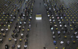 People wait for their turn to receive COVID-19 vaccine at a vaccination center in Iran Mall shopping center in Tehran, Iran, August 9, 2021. (AP Photo/Vahid Salemi)