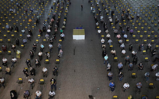 People wait for their turn to receive COVID-19 vaccine at a vaccination center in Iran Mall shopping center in Tehran, Iran, August 9, 2021. (AP Photo/Vahid Salemi) People wait for their turn to receive COVID-19 vaccine at a vaccination center in Iran Mall shopping center in Tehran, Iran, August 9, 2021. (AP Photo/Vahid Salemi)
