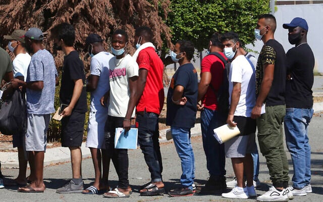 People wait in line to receive a vaccine shot against COVID-19 at a 'Walk-in' vaccination center on the grounds of Cyprus' State Fair in the capital Nicosia, Cyprus, on Friday, Aug. 13, 2021. (AP Photo/Philippos Christou) People wait in line to receive a vaccine shot against COVID-19 at a 'Walk-in' vaccination center on the grounds of Cyprus' State Fair in the capital Nicosia, Cyprus, on Friday, Aug. 13, 2021. (AP Photo/Philippos Christou)