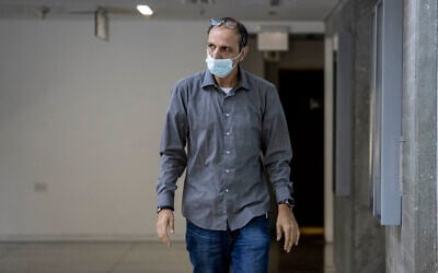 Shmulik Peleg, maternal grandfather of Eitan Biran, who survived a cable car crash in Italy that killed his immediate family, arrives at court in Tel Aviv, Oct. 8, 2021 (AP Photo/Tsafrir Abayov)