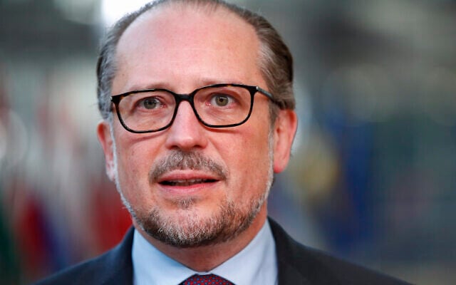 Austria's Chancellor Alexander Schallenberg talks to journalists as he arrives for an EU summit in Brussels, Friday, Oct. 22, 2021. (Johanna Geron, Pool Photo via AP) Austria's Chancellor Alexander Schallenberg talks to journalists as he arrives for an EU summit in Brussels, Friday, Oct. 22, 2021. (Johanna Geron, Pool Photo via AP)
