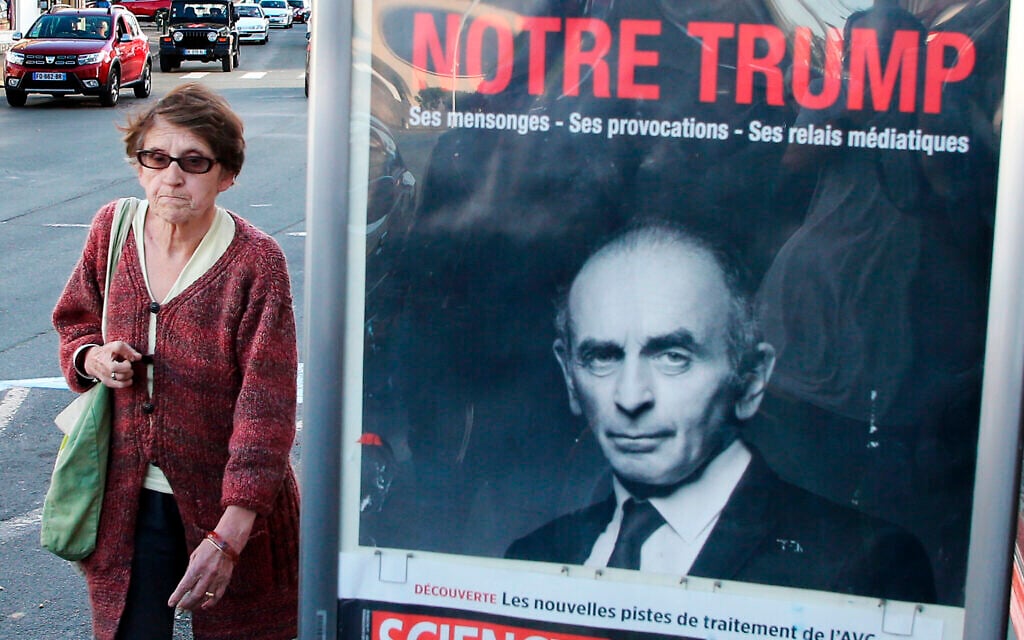 A woman walks past a poster of hard-right political talk-show star Eric Zemmour reading in French " Our Trump" in Biarritz, southwestern France, Oct. 28, 2021. (AP Photo/Bob Edme) A woman walks past a poster of hard-right political talk-show star Eric Zemmour reading in French " Our Trump" in Biarritz, southwestern France, Oct. 28, 2021. (AP Photo/Bob Edme)