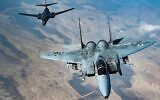 Illustrative: In this photo released by the US Air Force, an Israeli Air Force F-15 Strike Eagle flies in formation with a U.S. Air Force B-1B Lancer over Israel as part of a deterrence flight, on Saturday, October 30, 2021. (US Air Force/Senior Airman Jerreht Harris via AP)