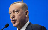 Turkey's President Recep Tayyip Erdogan speaks during a media conference at the G20 summit in Rome, on October 31, 2021. (AP Photo/Domenico Stinellis)