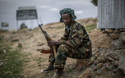 A fighter loyal to the Tigray People's Liberation Front (TPLF) mans a guard post on the outskirts of the town of Hawzen in the Tigray region of northern Ethiopia, on May 7, 2021. (AP Photo/Ben Curtis, File)