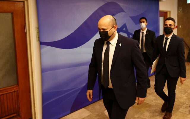 Prime Minister Naftali Bennett arrives for a cabinet meeting at the Prime Minister's Office in Jerusalem, November 3, 2021. (Ronen Zvulun/Pool Photo via AP) Prime Minister Naftali Bennett arrives for a cabinet meeting at the Prime Minister's Office in Jerusalem, November 3, 2021. (Ronen Zvulun/Pool Photo via AP)