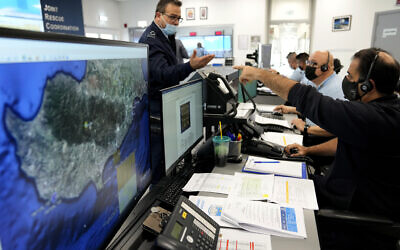 Officials observe Cypriot forces conducting rescue and counter-terrorism drills streamed live to monitors at the Joint Rescue Coordination Center during the 'Nemesis' exercise in the southern coastal city of Larnaca, Cyprus, November 3, 2021. (/Petros Karadjias/AP)