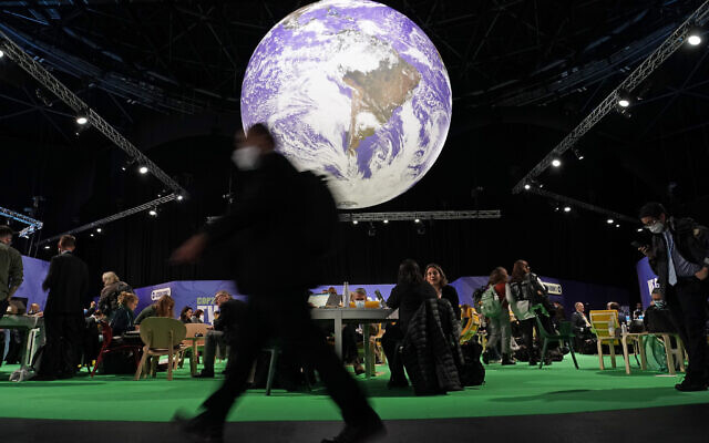 Delegates gather inside the venue on another day at the COP26 UN Climate Summit in Glasgow, Scotland, Wednesday, Nov. 3, 2021. (AP/Alberto Pezzali)