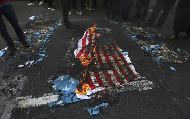 Mock US and Israeli flags are set on fire by demonstrators in a rally in front of the former US Embassy commemorating the anniversary of its 1979 seizure in Tehran, Iran, November 4, 2021. (AP Photo/Vahid Salemi) Mock US and Israeli flags are set on fire by demonstrators in a rally in front of the former US Embassy commemorating the anniversary of its 1979 seizure in Tehran, Iran, November 4, 2021. (AP Photo/Vahid Salemi)