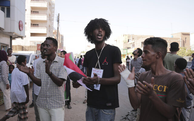 People chant slogans during a protest in Khartoum, amid ongoing demonstrations against a military takeover in Khartoum, Sudan, November 4, 2021. (AP Photo/Marwan Ali) People chant slogans during a protest in Khartoum, amid ongoing demonstrations against a military takeover in Khartoum, Sudan, November 4, 2021. (AP Photo/Marwan Ali)