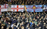 West Ham fans celebrate at the end of the group H Europa League soccer match between Genk and West Ham at KRC Genk Arena in Genk, Belgium, November 4, 2021. (AP/Olivier Matthys)