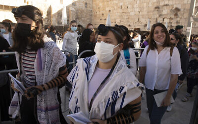 Members of the Women of the Wall wearing tefillin after the Rosh Hodesh, or new month prayer in the women's section at the Western Wall, the holiest site where Jews can pray, in the Old City of Jerusalem, Friday, Nov. 5, 2021.  (AP Photo/Maya Alleruzzo)
