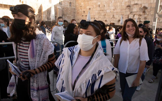 Members of the Women of the Wall wearing tefillin after the Rosh Hodesh, or new month prayer in the women's section at the Western Wall, the holiest site where Jews can pray, in the Old City of Jerusalem, Friday, Nov. 5, 2021.  (AP Photo/Maya Alleruzzo)