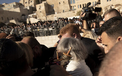 Members of the Women of the Wall clutch a Torah scroll as they are surrounded by Israeli security forces at the Western Wall, the holiest site where Jews can pray, in the Old City of Jerusalem, Friday, Nov. 5, 2021. (AP Photo/Maya Alleruzzo)